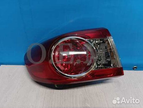 Фонарь левый внешний Toyota Corolla 10 E150