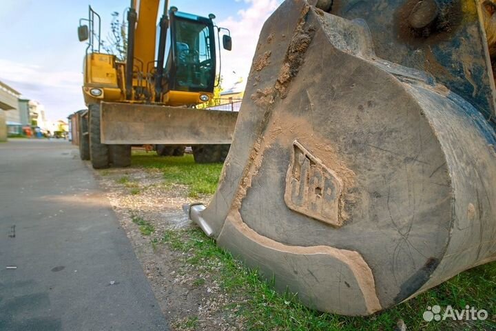 Услуги колесного экскаватора полноповоротного