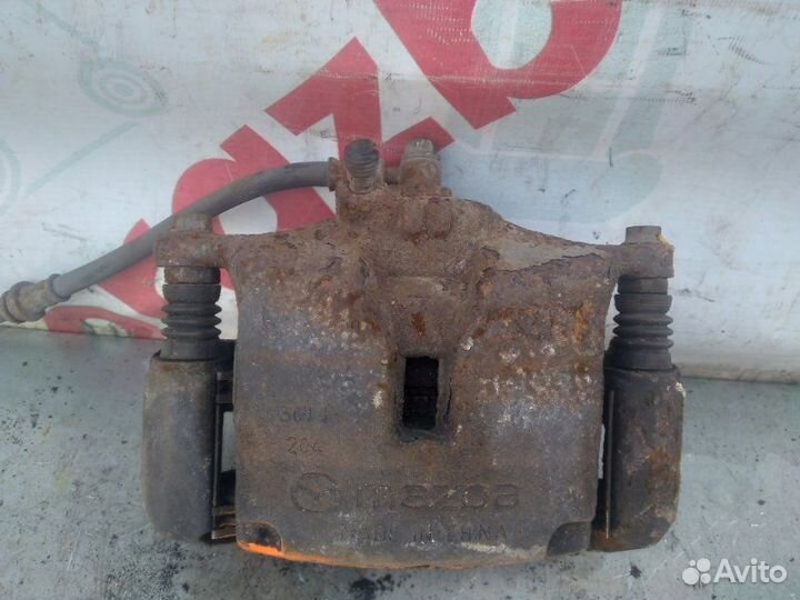 Суппорт тормозной передний правый Mazda 3 Bm