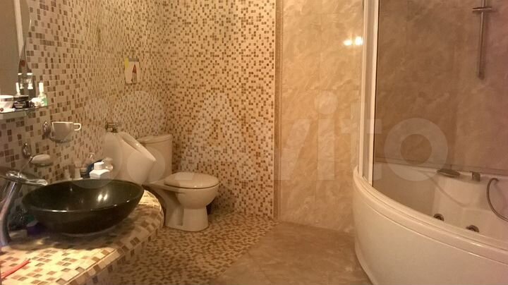 Коттедж 411 м² на участке 15 сот.