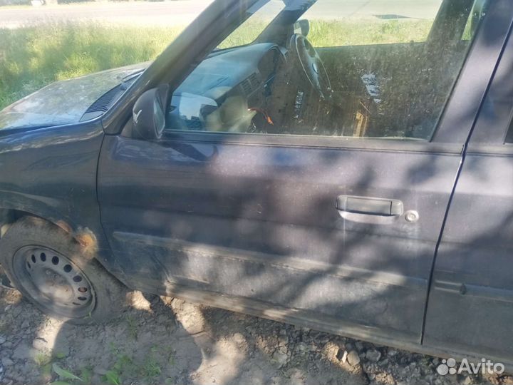 Двери mazda демио