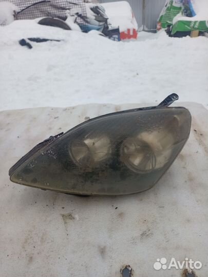 Фара левая Opel Zafira B 24451052