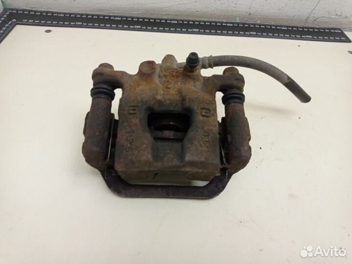 Суппорт тормозной задний правый Nissan Tiida