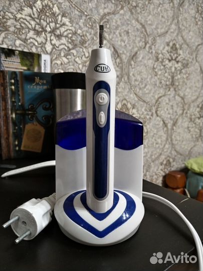 Электрическая зубная щетка