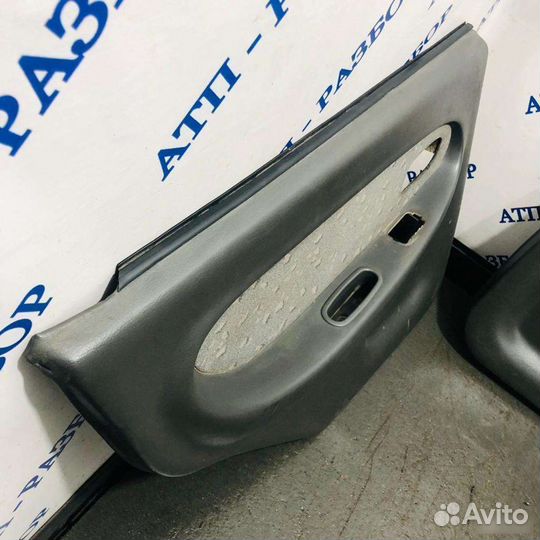 Обшивка двери задняя левая Kia Spectra 2001-2004