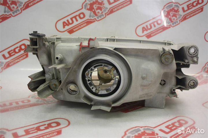 Фара левая Mazda Familia BH (1994 - 1998)