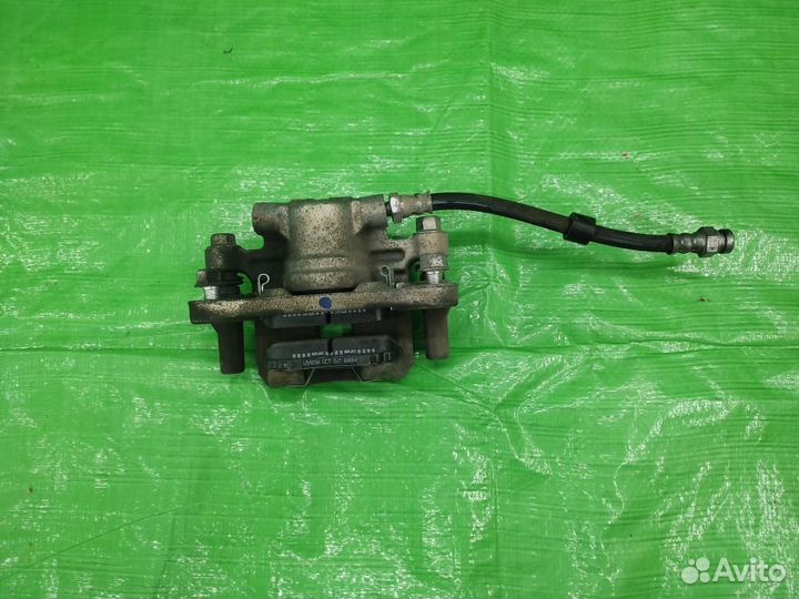 Суппорт зад. лев + колодки Caliber/Compass/Patriot