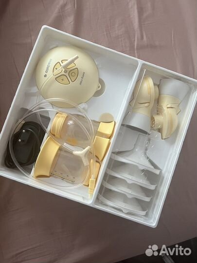 Молокоотсос medela электрический