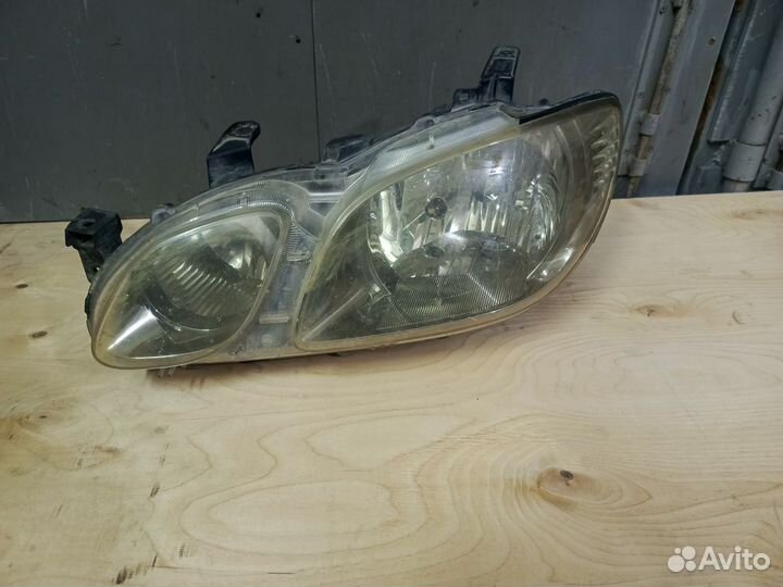 Фара левая Mitsubishi Airtrek