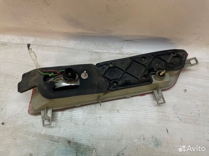 Фонарь в крышку багажнка задний левый Bmw 7-Series