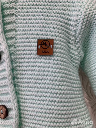 Вязанный комбинезон для новорожденного