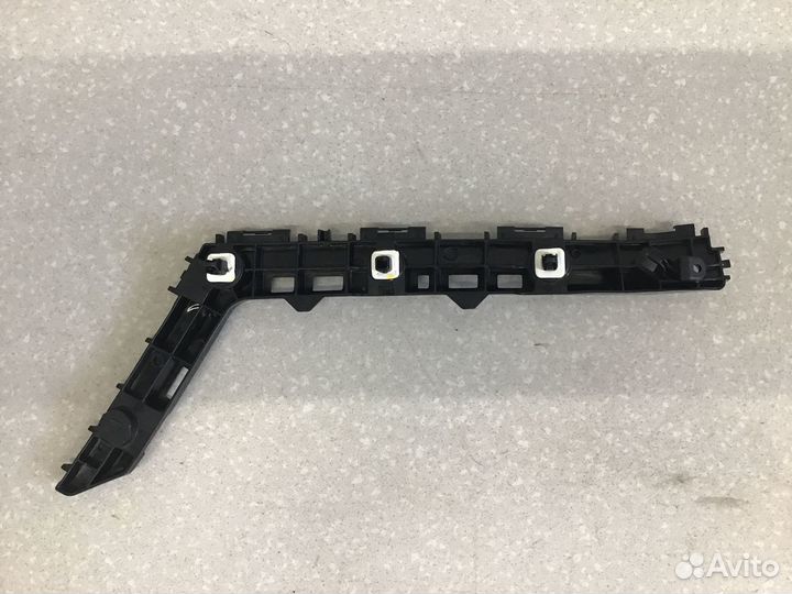 Кронштейн заднего бампера левый Toyota Corolla E21