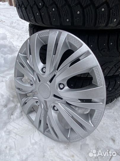 Комплект колес r15 Nokian Nordman с колпаками