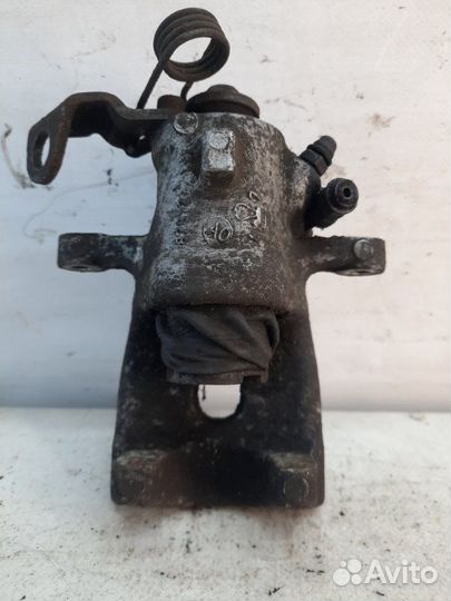 Суппорт тормозной задний левый Opel Astra