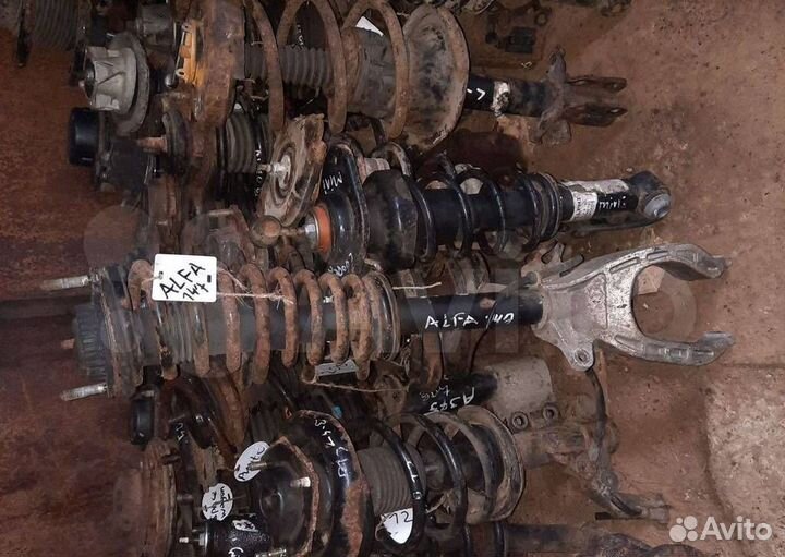 Стойка амортизатора передняя левая Alfa Romeo 147