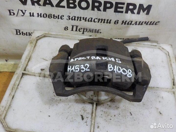 Суппорт тормозной передний левый Kia Spectra