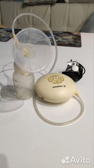 Молокоотсос medela электрический