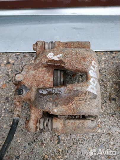 Суппорт тормозной передний правый Fiat Doblo