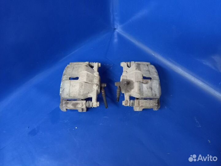 Суппорт тормозной передний Nissan Qashqai I рестай