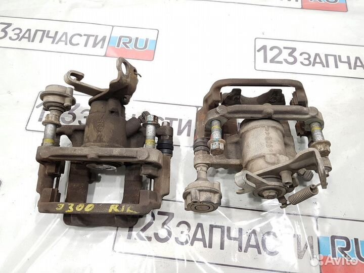 Суппорт тормозной задний левый Chevrolet Cruze