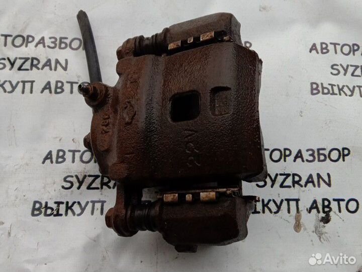 Суппорт левый Nissan Almera n15