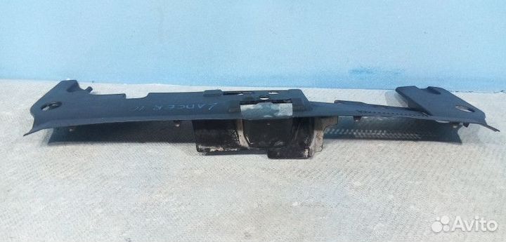 Кожух замка капота Mitsubishi Lancer 10