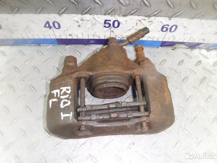 Суппорт тормозной передний левый Kia Rio