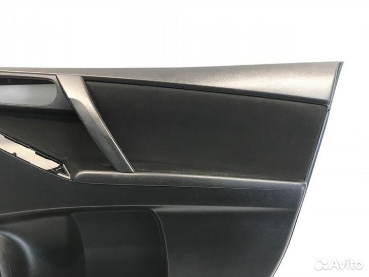 Обшивка двери передняя левая Mazda 3Bl седан 1.6