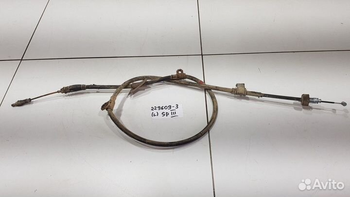 Трос стояночного тормоза левый (Kia Sportage)