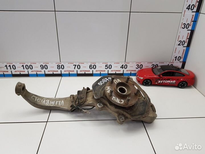 Кулак поворотный передний левый в сборе