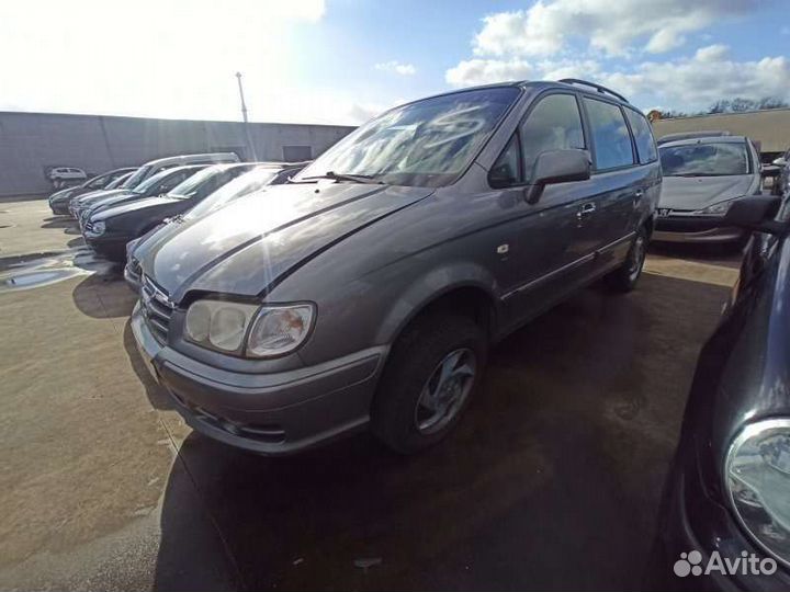 Замок двери передней левой Хундай Тражет 04г