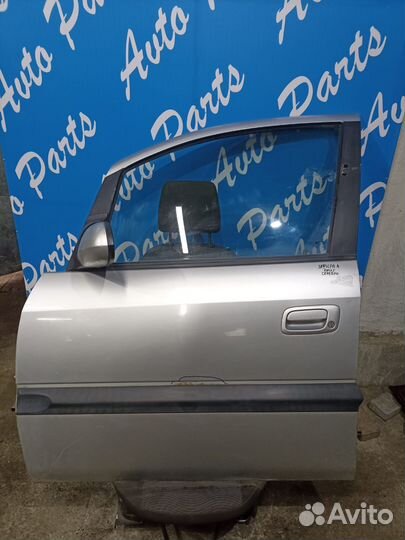 Дверь передняя левая Опель Зафира А серебристая