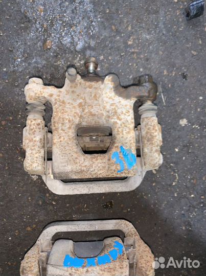 Суппорт тормозной задний Nissan Qashqai J10