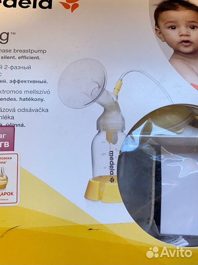 Молокоотсос medela электрический