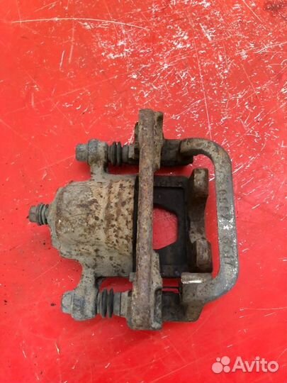 Суппорт тормозной задний правый Nissan Qashqai J10