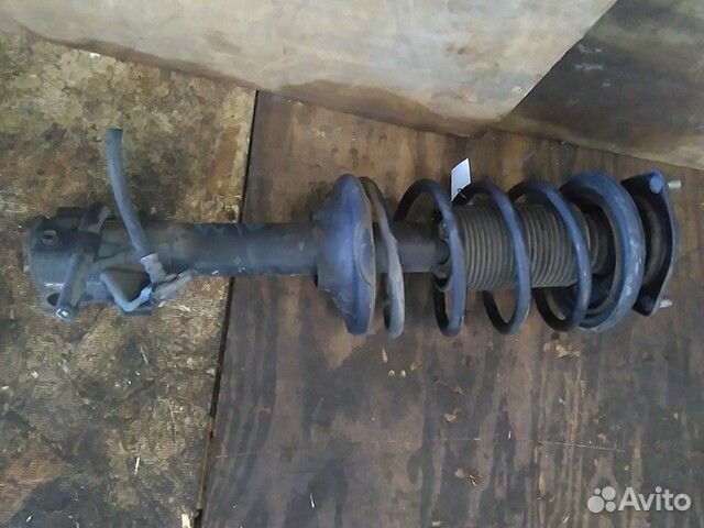 Амортизатор подвески передний левый Nissan Avenir