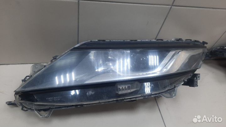 Фара левая Mitsubishi L200