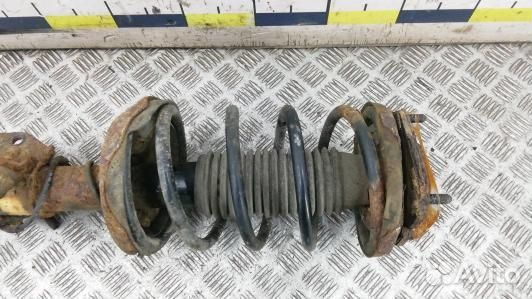 Стойка передняя левая mazda 323 BJ (8SE20K501)