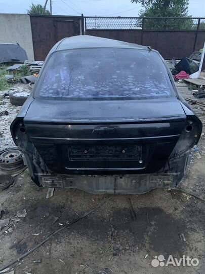 Chevrolet aveo т250 крышка багажника черная завод