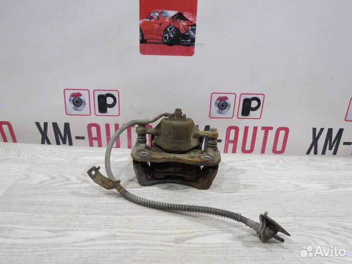 Суппорт тормозной передний левый Kia Rio 3