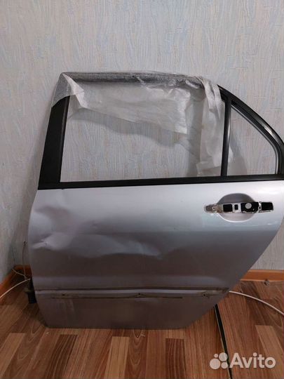 Дверь задняя левая Lancer ix серебристая