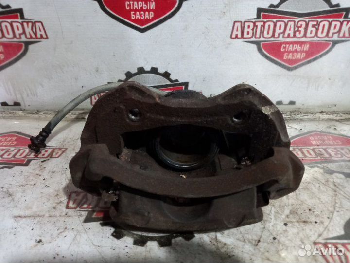 Суппорт тормозной передний левый Nissan Atlas