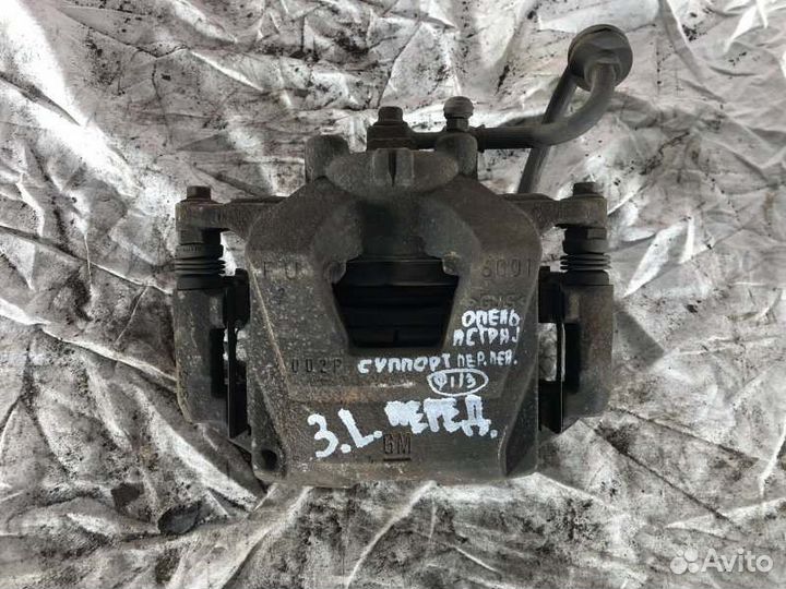 Суппорт тормозной передний левый Opel Astra J До