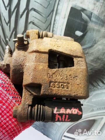 Суппорт тормозной передний левый lanos