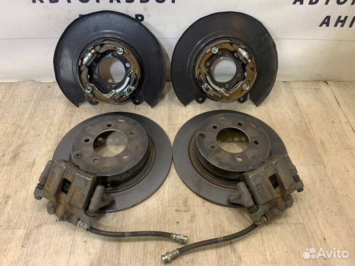 Суппорта и диски задняя Mitsubishi Lancer 10 CY3A