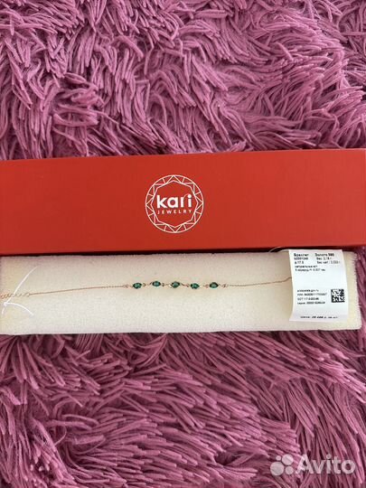 Золотой женский браслет с изумрудами