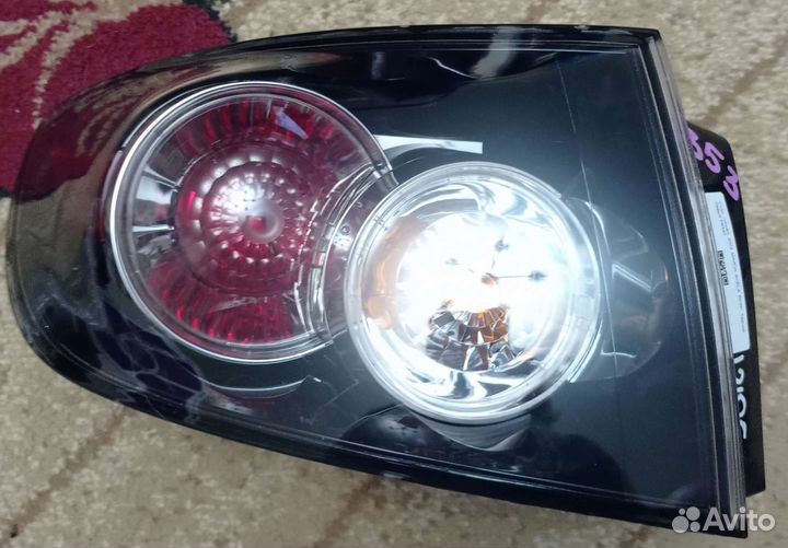 Фонарь задний левый Mazda 3BK седан оригинал