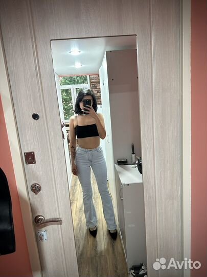 Джинсы клеш от колена, светло-голубые