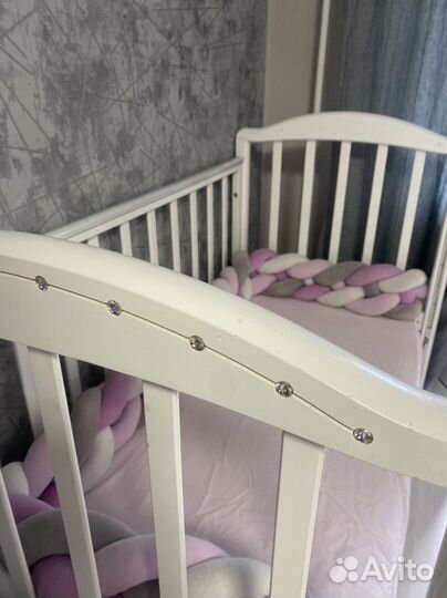 Детская кроватка с продольным маятником