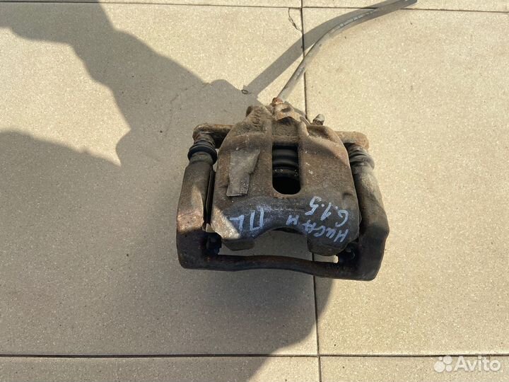 Тормозной суппорт перед лев Nissan Almera G15